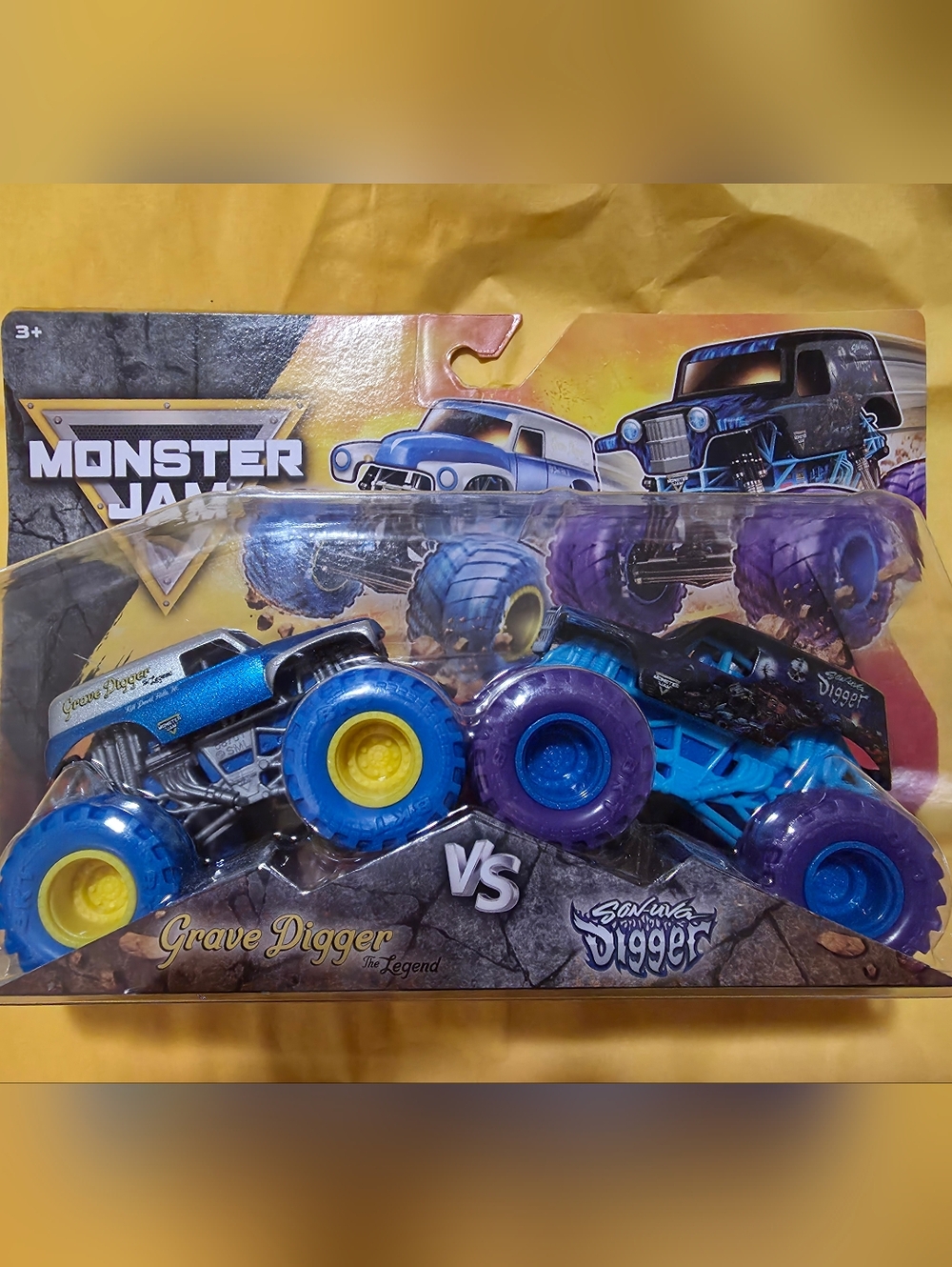 Monster Jam Grave Digger vs. Son-uva Digger Twin Pack - Blue & Purple Truck Set